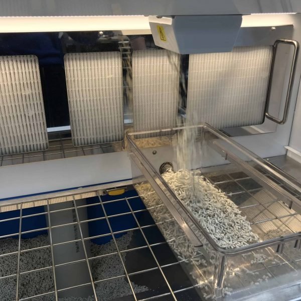 SychemFILL In Process of filling lab animal cage bedding dispenser
